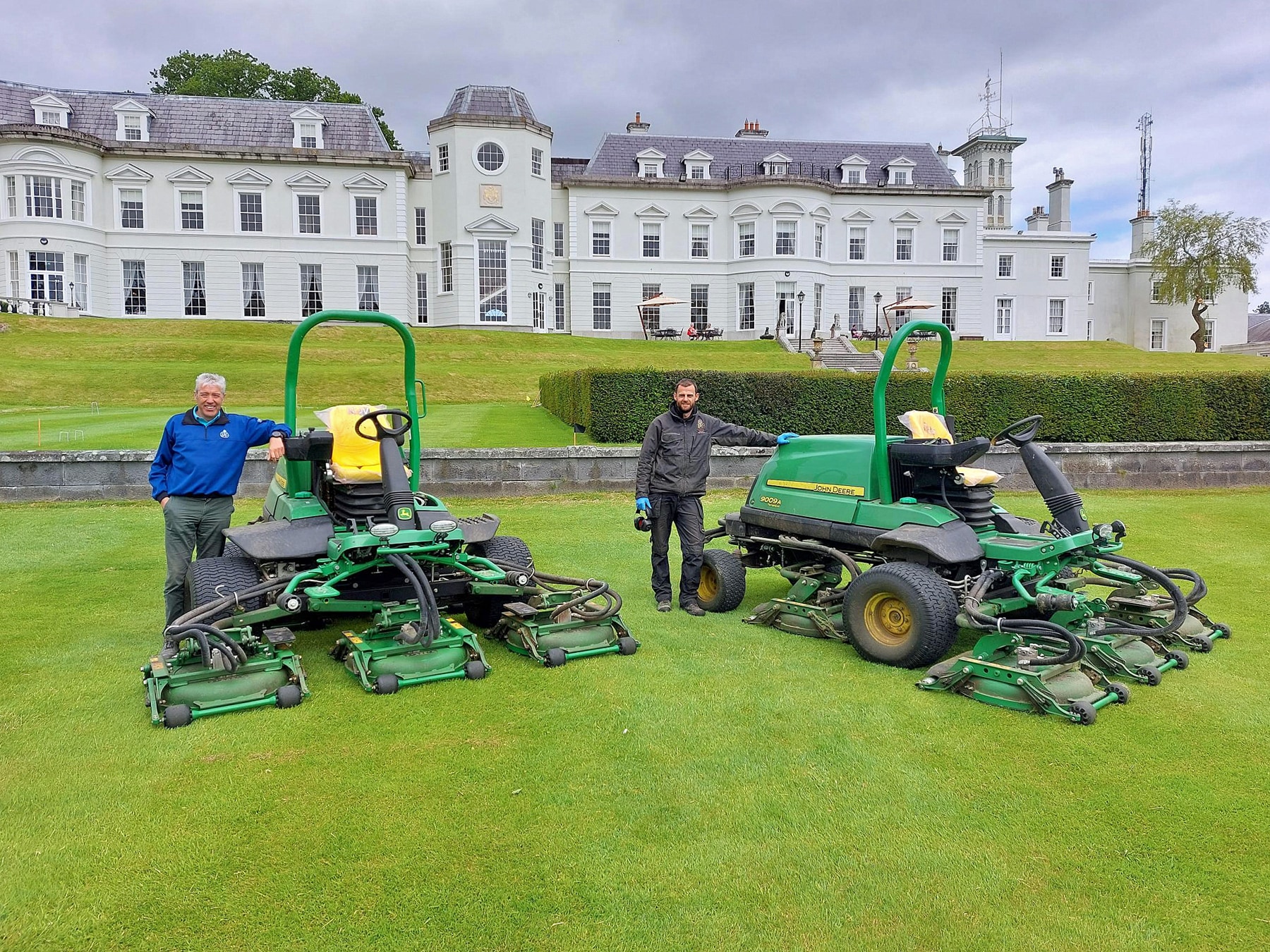 The K Club Resort Superintendent Gerry Byrne (left) with his Deputy Jamie Robson and the new John Deere 9009A TerrainCut rotary rough mowers.